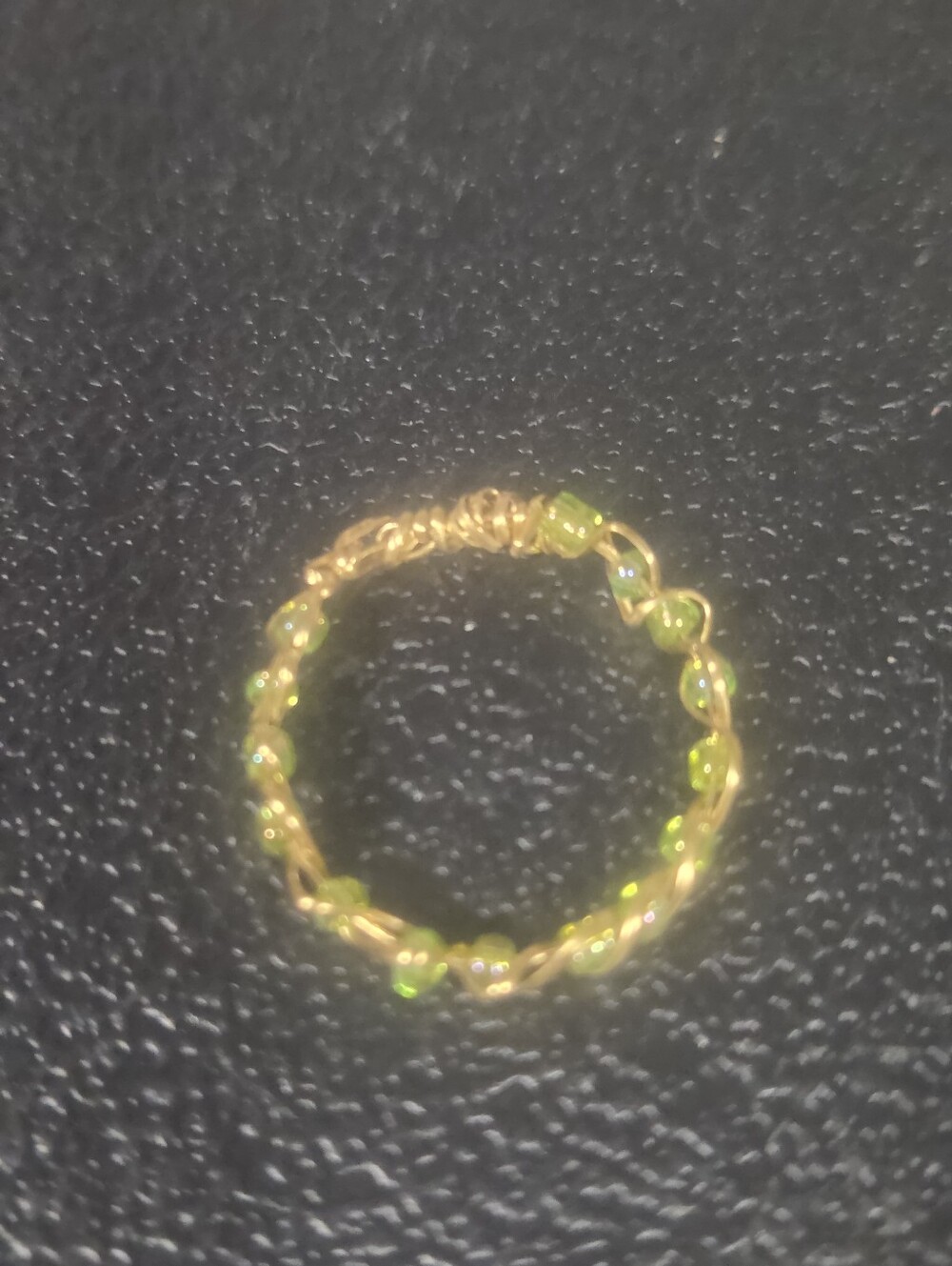 Handcrafted Gold-Tone Ring with Green Bead Accents